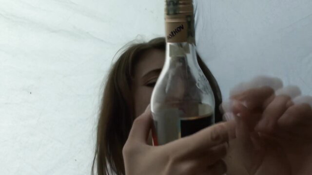 Kristyna holds wine bottle in fidelity test, sexy amateur tease