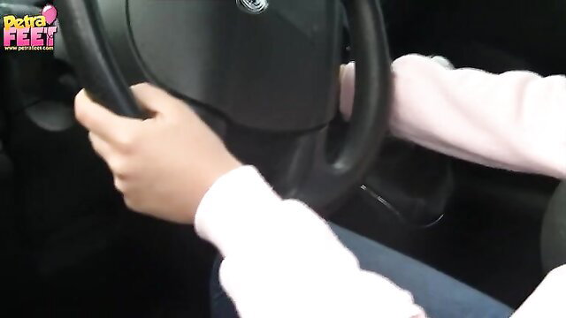 Foot Lover Petra barefoot driving car, gripping wheel with hands