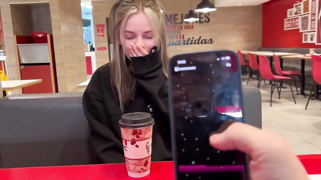 Blonde teen Devdaria in black hoodie at KFC spits on phone in hot tease