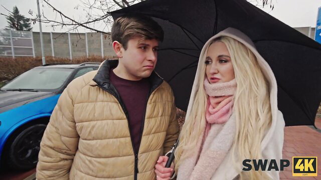Blonde Veronica Leal and guy under umbrella in rain, hot FFM threesome