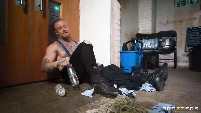 Danny D passed out drunk, shirtless with tattoos in Brazzers scene