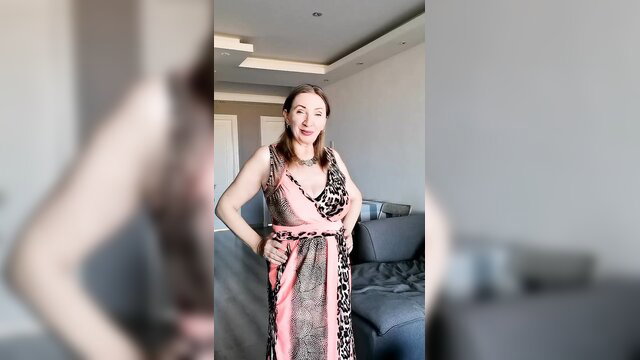 Mature white woman in sexy leopard print dress, caught undressing tease