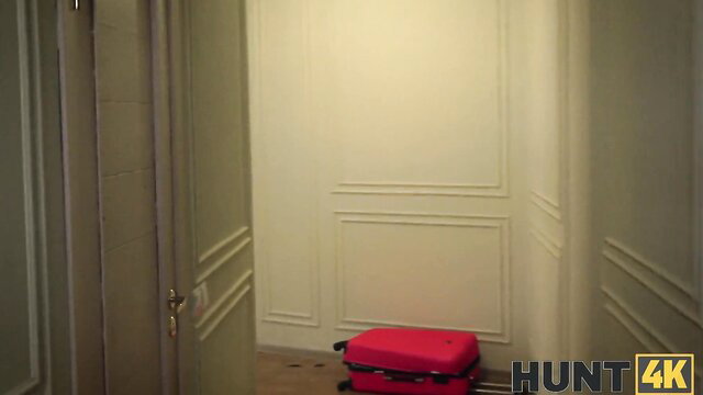 Novella Night by red suitcase in elegant hallway, Hunt4K adult scene
