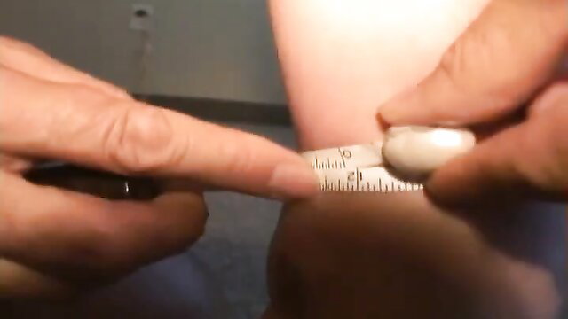 Amazon Amanda measures masked Asian's big cock with ruler closeup
