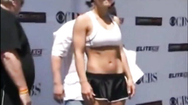 Gina Carano sexy body shots, ripped abs and fit physique at event