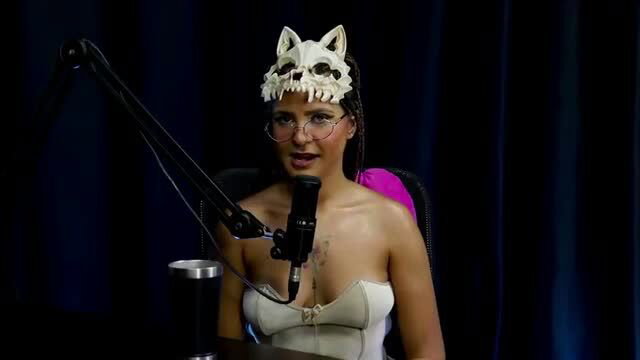 Barbara Sol in skull cat mask bares cleavage in sexy striptease