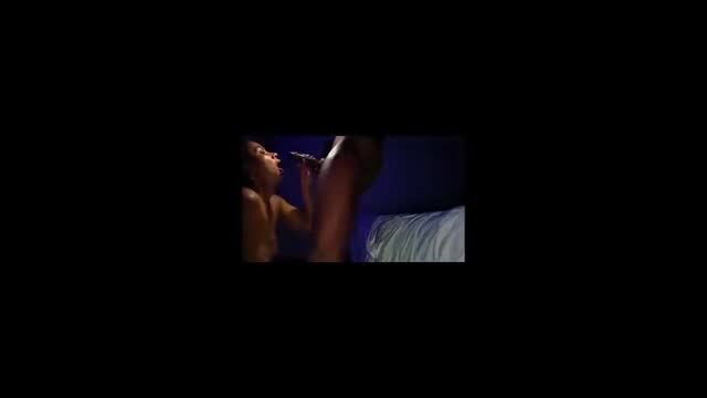 Numi Zarah gives oral to Ray Black in dark bedroom