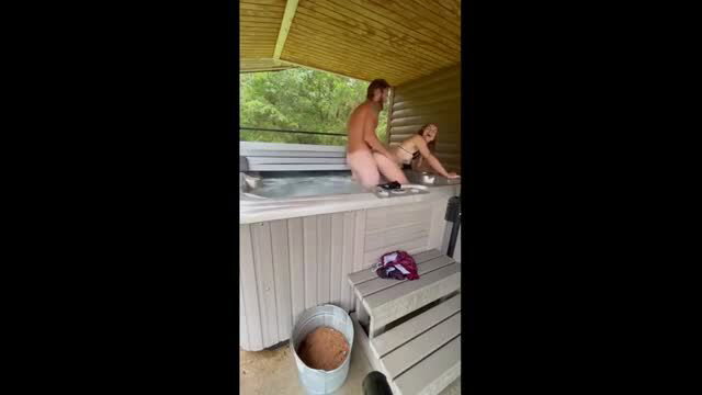 Blonde petite woman with naked man enjoying first-time hot tub sex at cabin