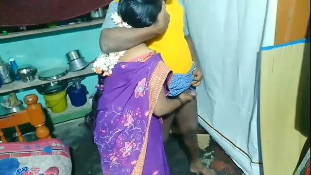 Indian auntie in purple sari getting intimate with uncle from behind