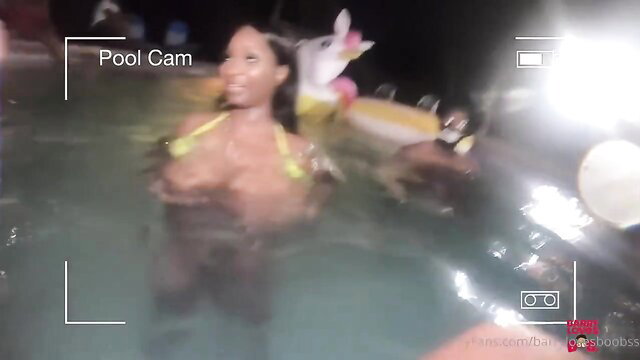 Roxi Red busty ebony wet in yellow bikini at Barry's Booby Pool Fest