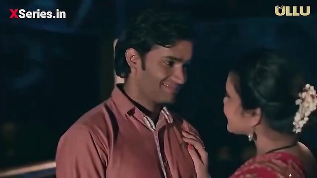 Indian bhabhi in red saree flirts with smiling man closeup