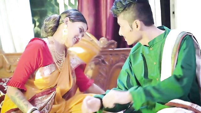 Desi Indian bride in yellow saree flirts with husband in green kurta