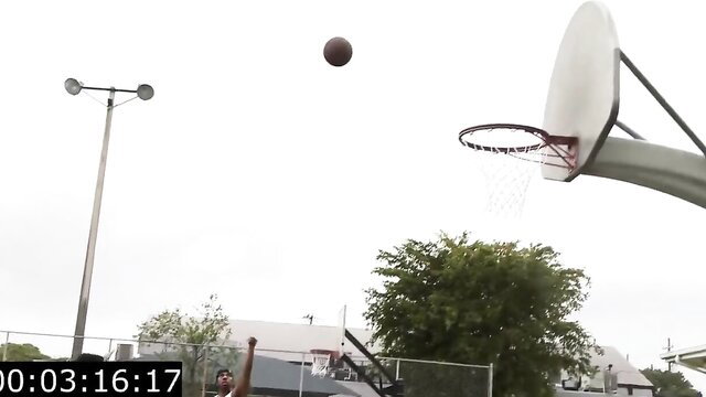 Basketball court outdoor scene with flying ball and hoop, athletic play action