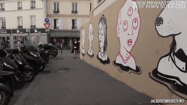 Jacquie Et Michel TV urban street art mural with quirky faces, Paris vibe