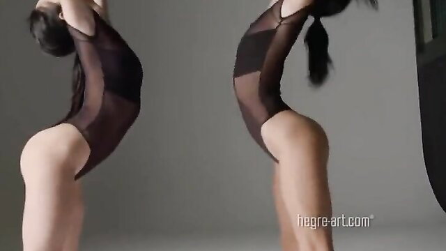 Magdalena in sheer black bodysuit, bending nude dance pose, Hegre