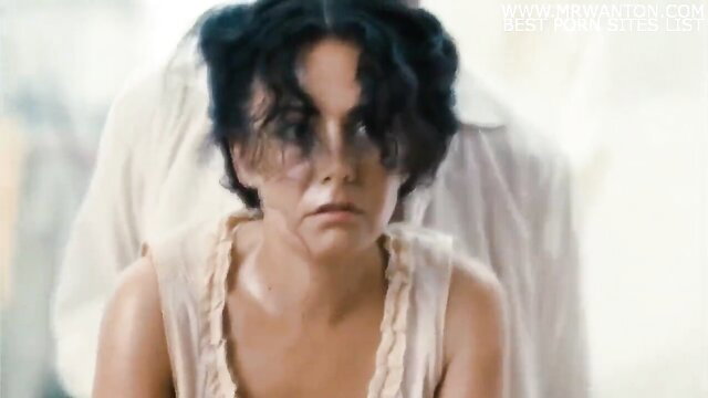 Brunette woman in cream slip top, intense close-up gaze, xHamster anal plea scene
