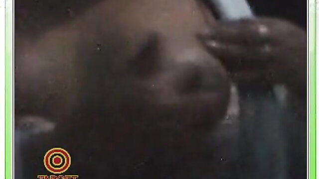 Closeup of dark-skinned Latina woman licking lollipop sensually