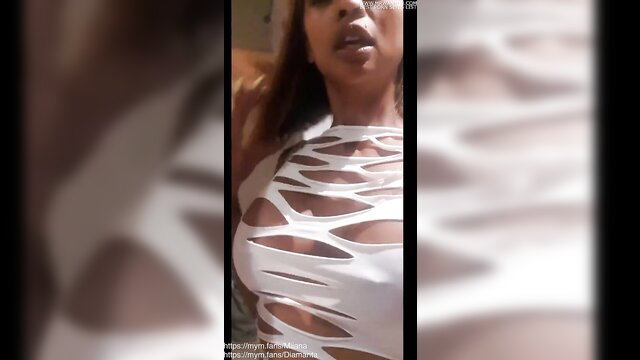 Miiana in torn white top exposing huge black tits at libertine party
