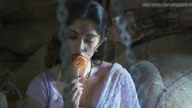Indian actress Amrita Das Gupta sucking lollipop in sheer saree blouse
