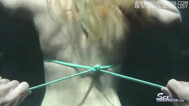Topanga Fox blonde mermaid bound with green ropes in erotic underwater scene
