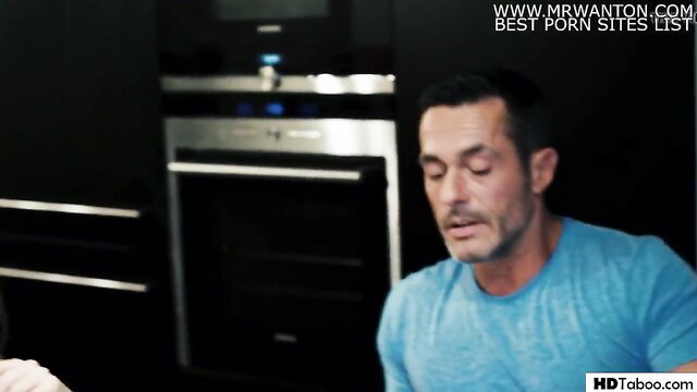 Hot dad in blue tee seduces family friend in kitchen at night