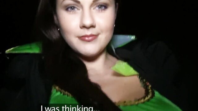Tina Kay in sexy green Halloween dress with cleavage