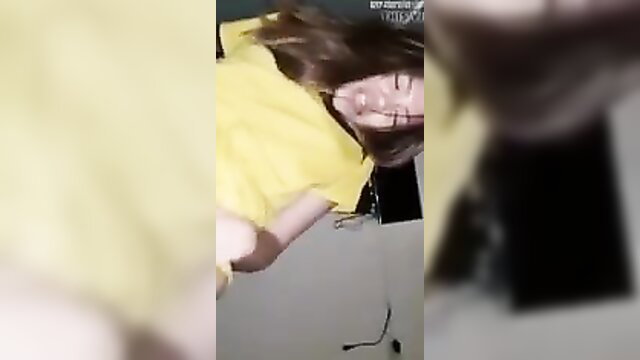 Asian babe in yellow top bends over exposing ass in amateur porn thumbnail
