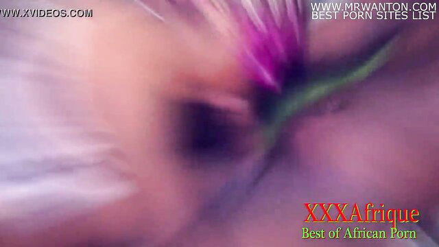 Blurred pregnant African woman closeup with purple flower, XXXAfrique porn