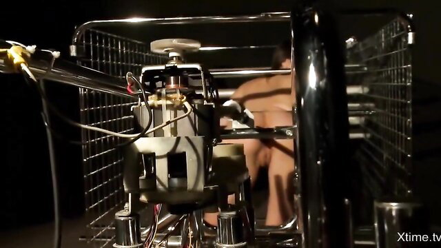 Valentina Nappi nude in BDSM machine bondage with metal cart frame