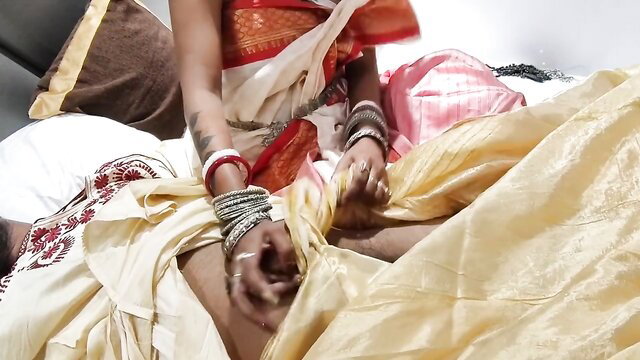 Newlywed Desi bride in red saree undresses hubby on first night