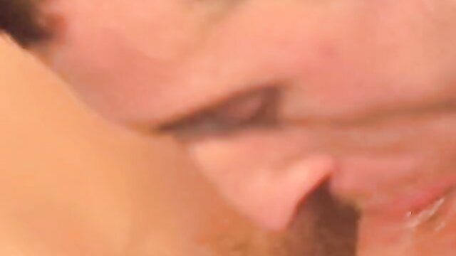 Closeup of handsome French hetero guy's ear and cheek in gay blowjob tease