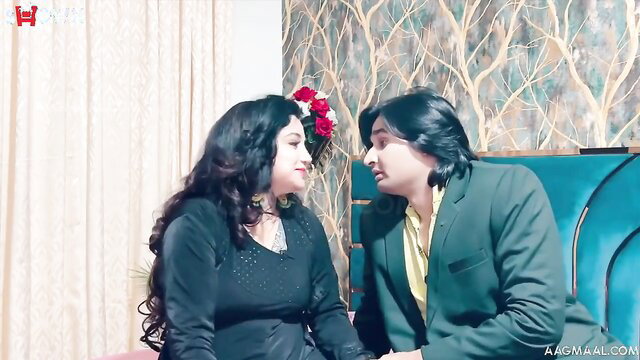 Indian couple in intimate close-up, busty woman with big ass in black dress