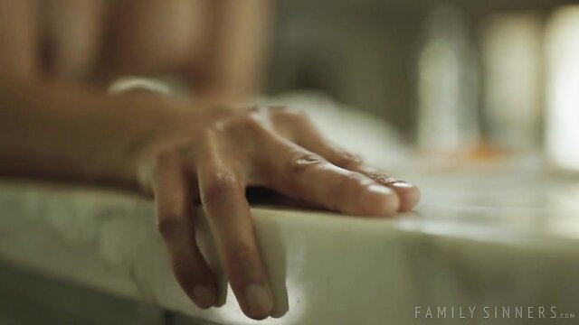 Penny Barber's hand gripping counter in steamy Family Sinners scene