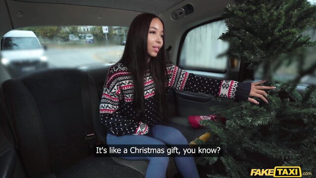 Lia Lin Asian cutie in Christmas sweater gives gift in Fake Taxi car POV