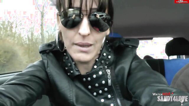Dirty-talk MILF Sandy4Love in studded leather jacket, sunglasses, car POV