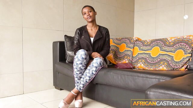 Busty African hottie Chicky Clarissa in sexy lingerie on couch