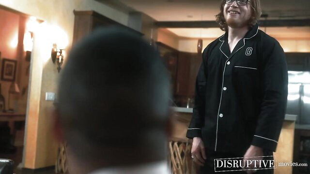 Dillon Diaz in black pajamas faces housesitter Kyle Connors in Disruptive Films scene