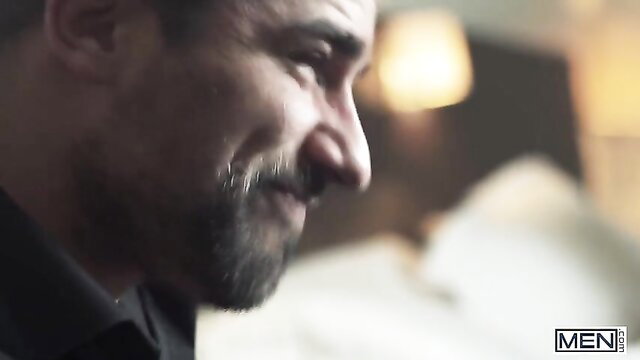 William Seed smirking closeup, muscular bearded stud from MEN