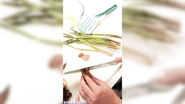Kylie Rocket trims asparagus in kitchen, Banned Stories thumbnail