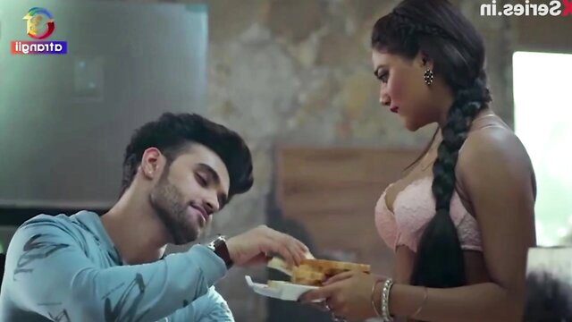 Indian couple feeding food, busty woman in pink bra braid kisses man