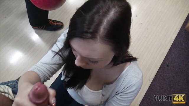 Brunette teen holds stranger's cock in bowling alley cash sex setup