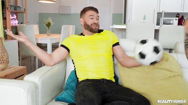 Lena Coxx with soccer player in yellow jersey holding ball Reality Kings