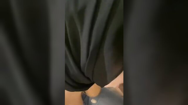 Malay woman in black hijab lifting dress showing shaved pussy upskirt