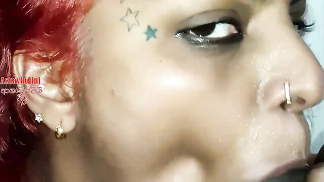 Closeup of Nilmini Sheron's teary eyes and face in intense foursome blowjob