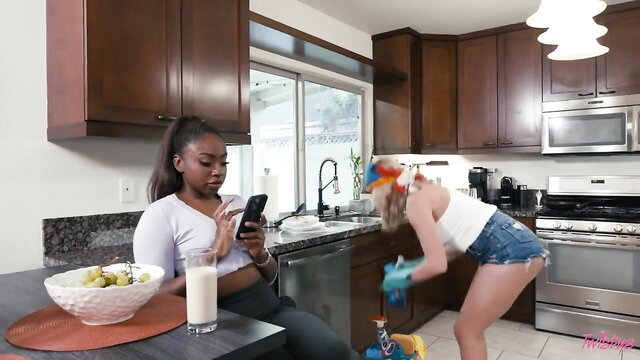 Tiffany Watson bends over in shorts as black babe watches on first day