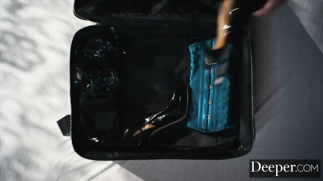 Avi Love's black corset, heels in open suitcase - Deeper BDSM slave prep