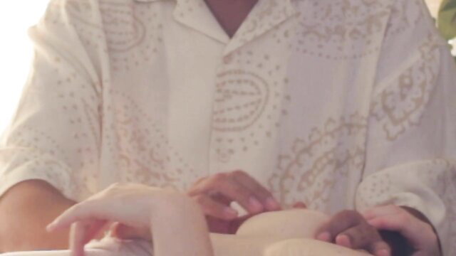 Curvy white woman fondled by black hands in shamanic ritual