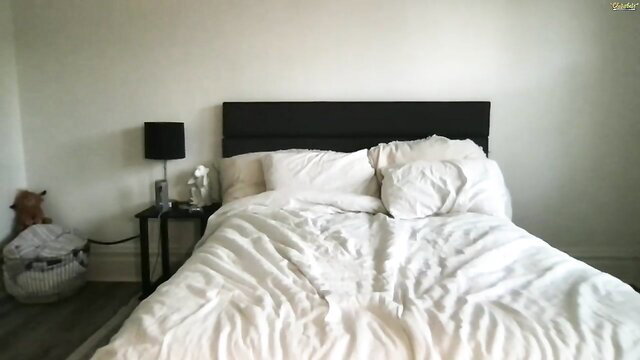 ScarletLetterose's cozy bedroom with white sheets and pillows