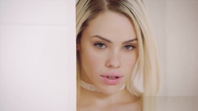 Young blonde teen closeup pouty lips, seductive eyes peeking out