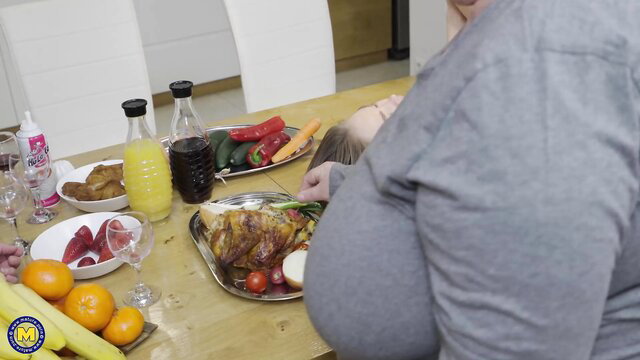 Fat mature Helena Jonic at dinner table with huge tits spilling out